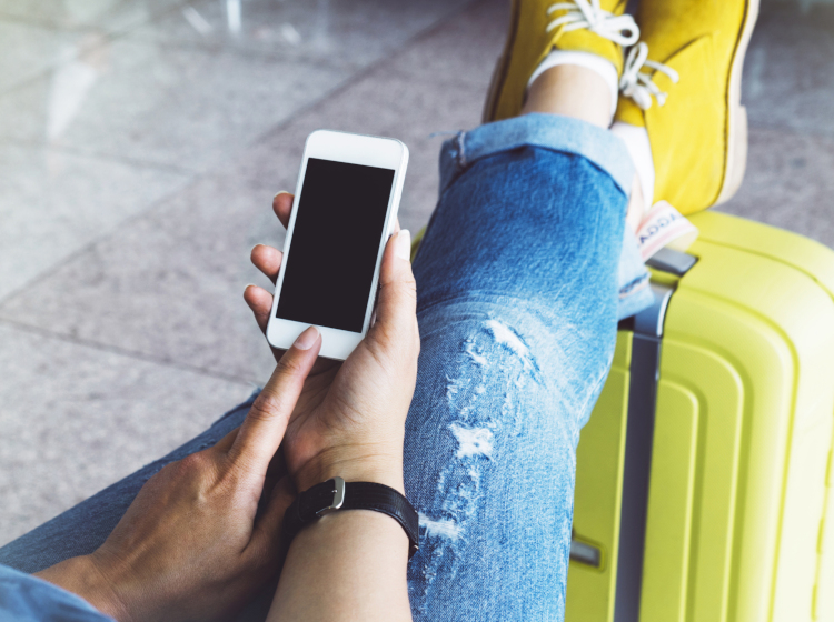 tourist using mobile phone apps
