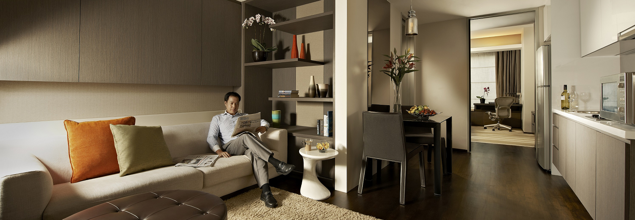 Man lounging on sofa serviced residence