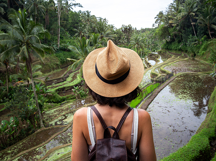 woman facing a terrace field