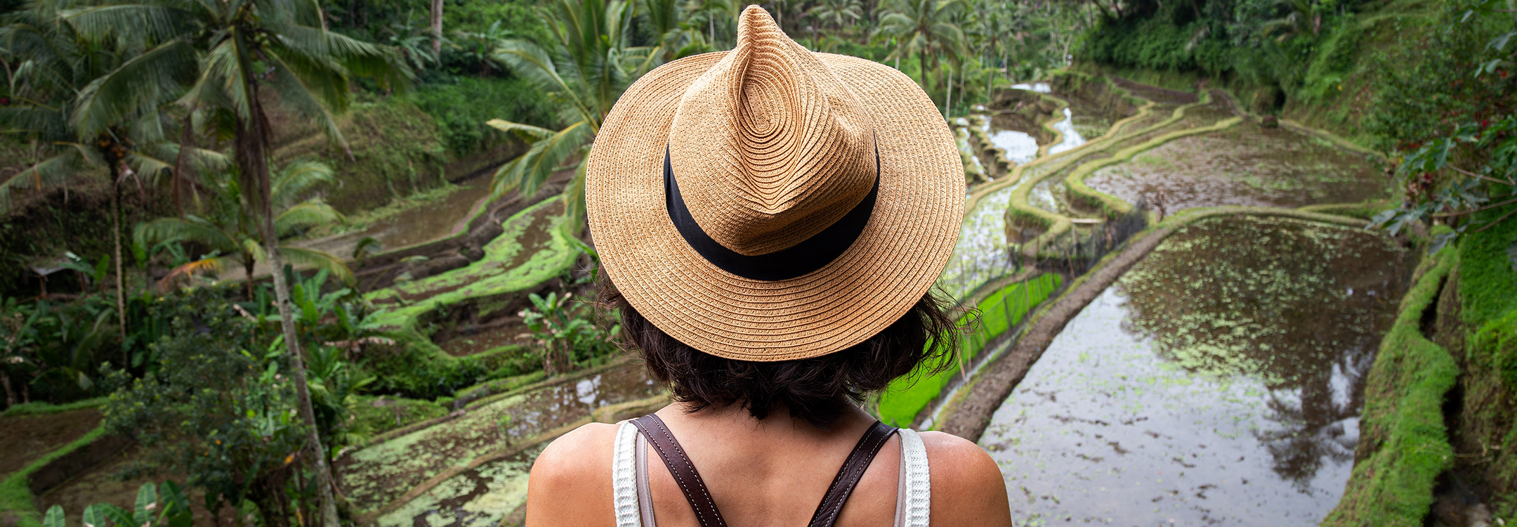 woman facing a terrace field