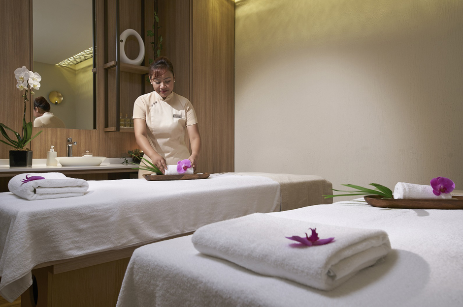 massage therapist preparing a room at st gregory’s spa