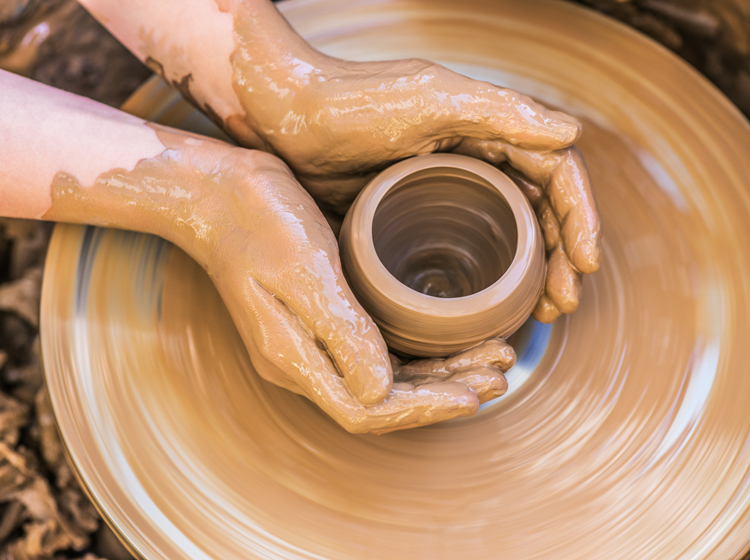 hands and potters wheel