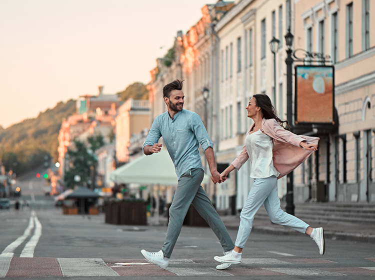 romantic couple crossing street