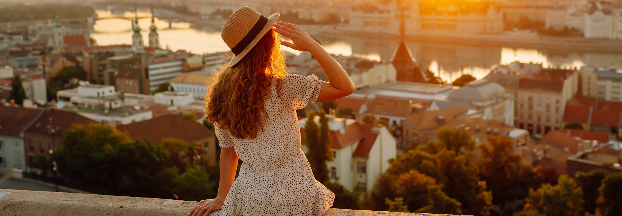 Woman admiring colourful sunset