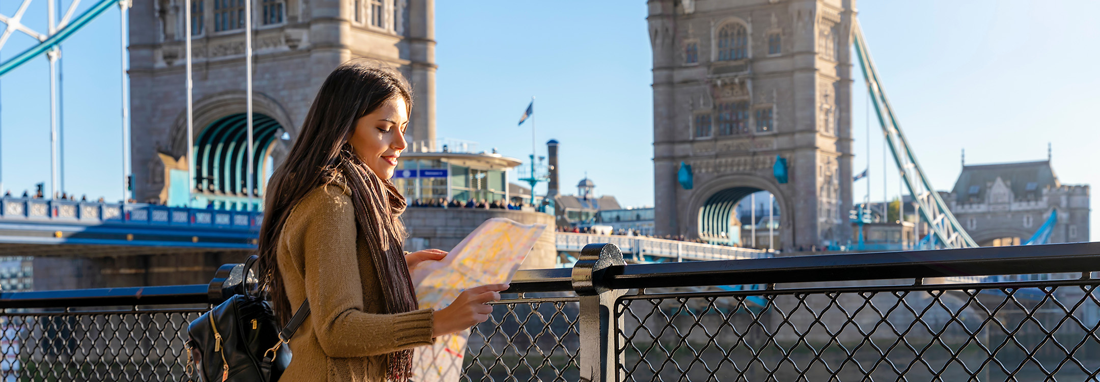 lady traveller in front of tower bridge london