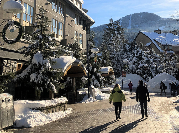 Skiers at Whistler village in the winter