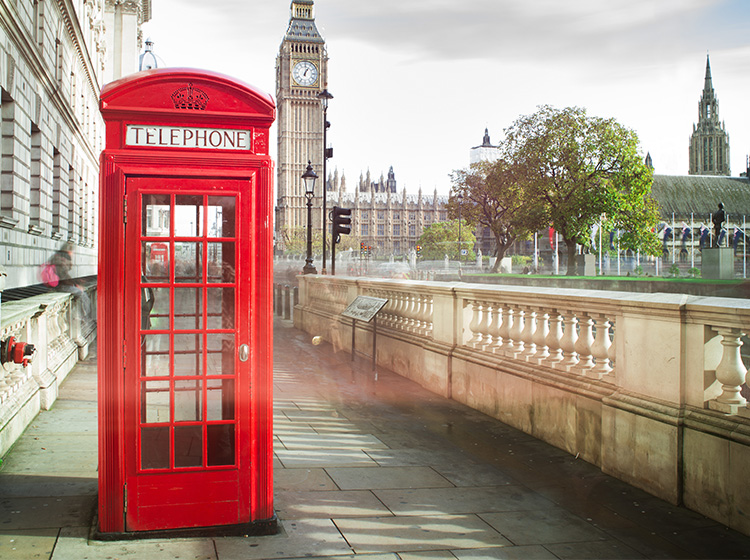red phone booth with big ben in background