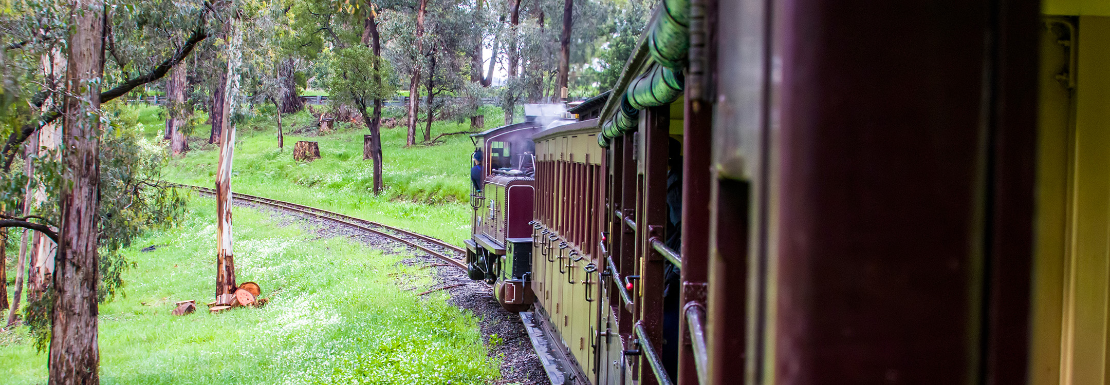 old steam train crossing a bridge